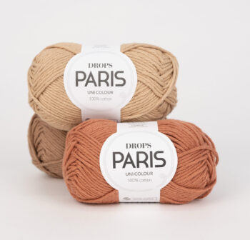 Tre gomitoli di filato Drops Paris beige e marrone con etichetta originale visibile